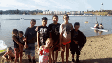 a group of children posing for a picture with one wearing a t-shirt that says ' california ' on it