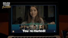 a laptop screen says you 're muted on the bottom right