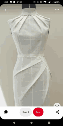 a picture of a white dress on a mannequin with a read it and save button