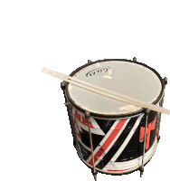 a drum with a stick on it that says ' vtg ' on the top