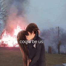 a couple kissing in front of a burning house with the words " could be us " below them