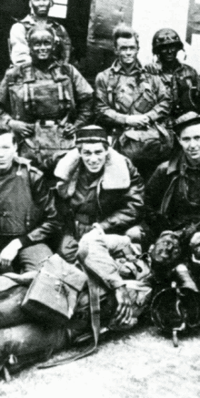 a black and white photo of a group of soldiers posing