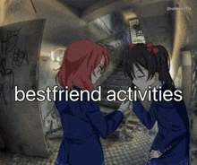 a couple of anime girls are standing next to each other in a dark room holding hands .