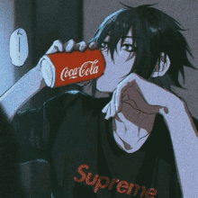 a boy is drinking a coca cola from a can while wearing a supreme shirt