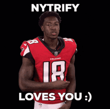 a falcons player says nytrify loves you on a black background