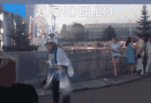 a blurry picture of a person with the word candello on the bottom right