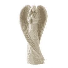 a statue of a woman with wings holding a heart