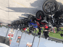 a row of motorcycles are parked in front of a sign that says ' steakhouse '