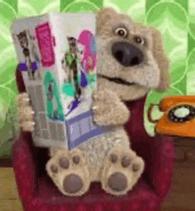 a teddy bear is sitting in a chair holding a box that says ' gossip ' on it