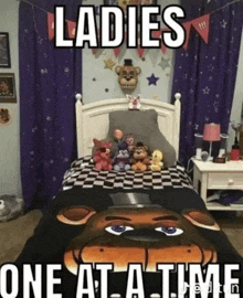 a bed with a blanket that says ladies one at a time .