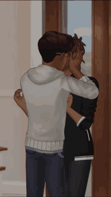 a man and a woman are hugging in front of a door