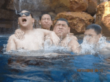 a group of men are in a pool with the date 14/11/2010 on the bottom