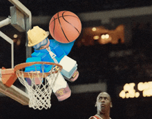 a lego basketball player is dunking a basketball in a hoop while michael jordan watches