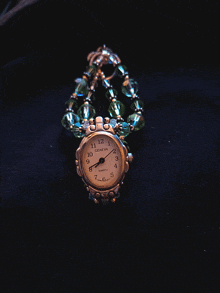 a geneva quartz watch is on a black background