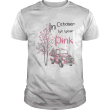 a shirt that says in october we wear pink with a red truck