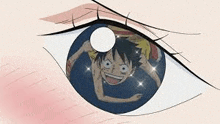 a close up of a person 's eye with a picture of monkey d luffy in the eye .