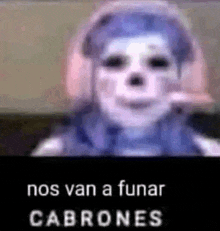 a blurry picture of a person wearing headphones and a mask with the words nos van a funar cabrones .