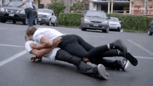 a couple laying on top of each other in a parking lot with the word viceland on the bottom right