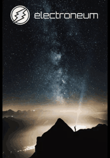 a poster for electroneum shows a person standing on a mountain at night