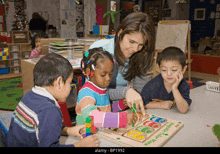 a group of children are playing with a wooden maze