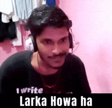 a man wearing headphones and a t-shirt that says i write larka howa ha