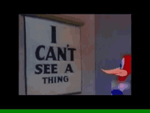 woody woodpecker is standing next to a sign that says `` i can 't see a thing ''