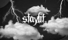 a black and white photo of lightning and clouds with the word stayfit in the foreground