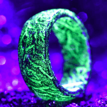 a glow in the dark ring with a green glow