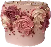 a pink cake decorated with pink and purple frosting and gold beads