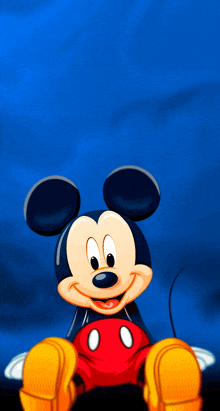 a cartoon of mickey mouse is sitting on a blue background