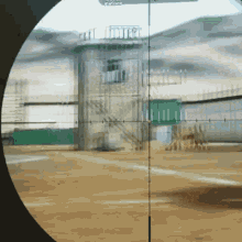 a sniper scope shows a building with a sign that says carriers