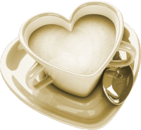 a heart shaped coffee cup with a spoon on a saucer