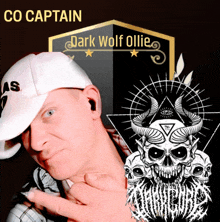 a man wearing a white hat is standing in front of a sign that says co captain dark wolf ollie