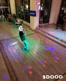 a picture of a man on a dance floor with the word dood on the bottom right