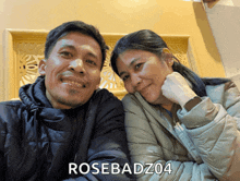 a man and a woman are posing for a picture with the name rosebadz04