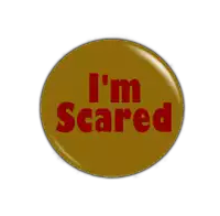 a button that says i 'm scared in red on a brown background