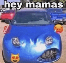 a blue car with a face painted on it is parked in a parking lot with emojis on it .