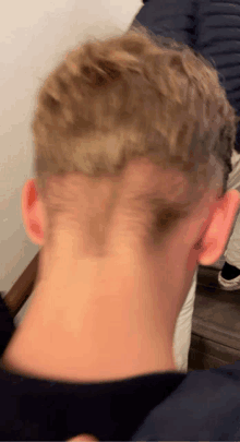 a close up of a man 's head with a shaved line in it