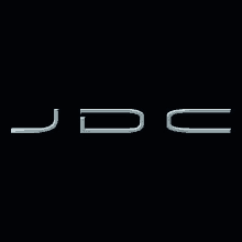 the jdc logo is on a black background with a silver border .