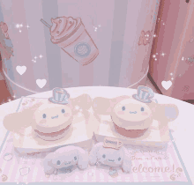 two cinnamoroll cupcakes sit on a table with a welcome mat