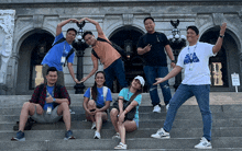 a group of people posing for a photo with one wearing a star wars shirt