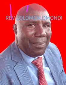 a man in a suit and tie is smiling with the name rev solomon omoni above him