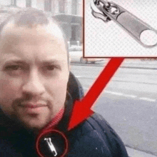 a man is taking a selfie with an arrow pointing to a zipper on his jacket .