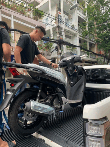 a man is working on a motorcycle that has the word honda on it