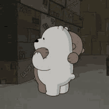 ice bear and grizzly bear are hugging each other in a warehouse .