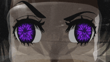 a close up of a person 's eyes with a purple flower in them