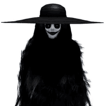 a woman in a black hat with a fake smile on her face is standing in the dark .