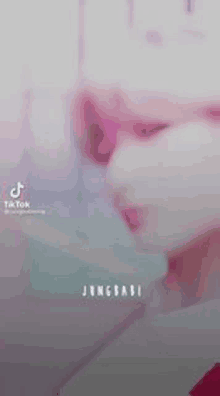 a close up of a person 's face with the words `` jungbabe '' written on the bottom .