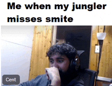 a man wearing headphones with the caption " me when my jungler misses smite cent "