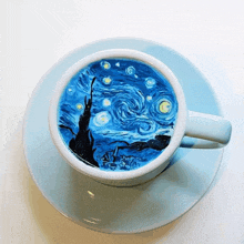 a cup of coffee on a saucer with a starry night painted on it